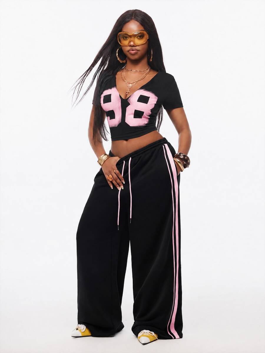 Women's wide leg trousers with a tree branch graphic pattern, loose fit, and mid-rise waist in woven fabric.
