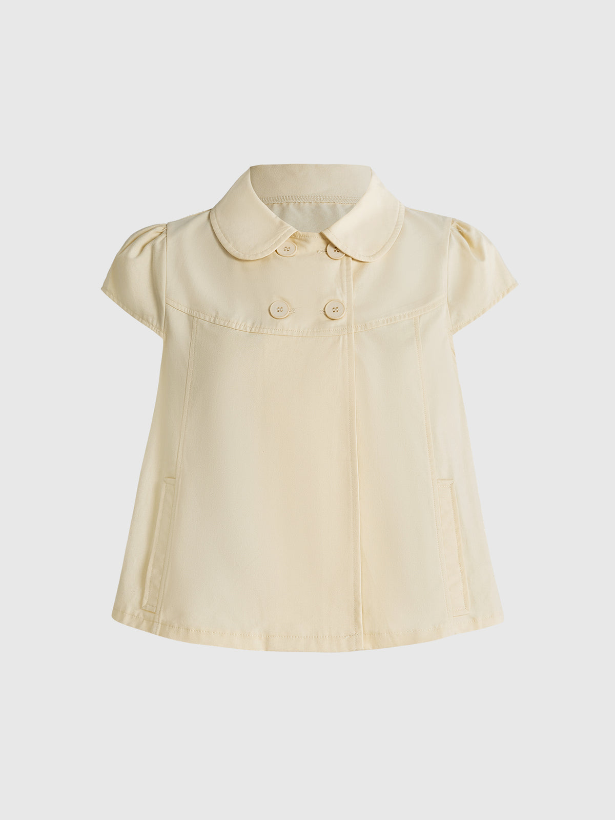 Women's short puff sleeve cotton blouse featuring a Peter Pan collar, double button detail, and front pocket.