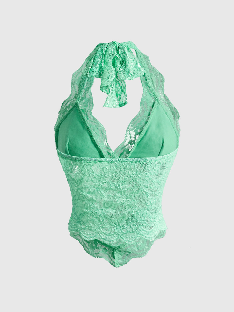 Women's lace halter neck crop top with backless tie closure, scallop trim, and asymmetrical hem.