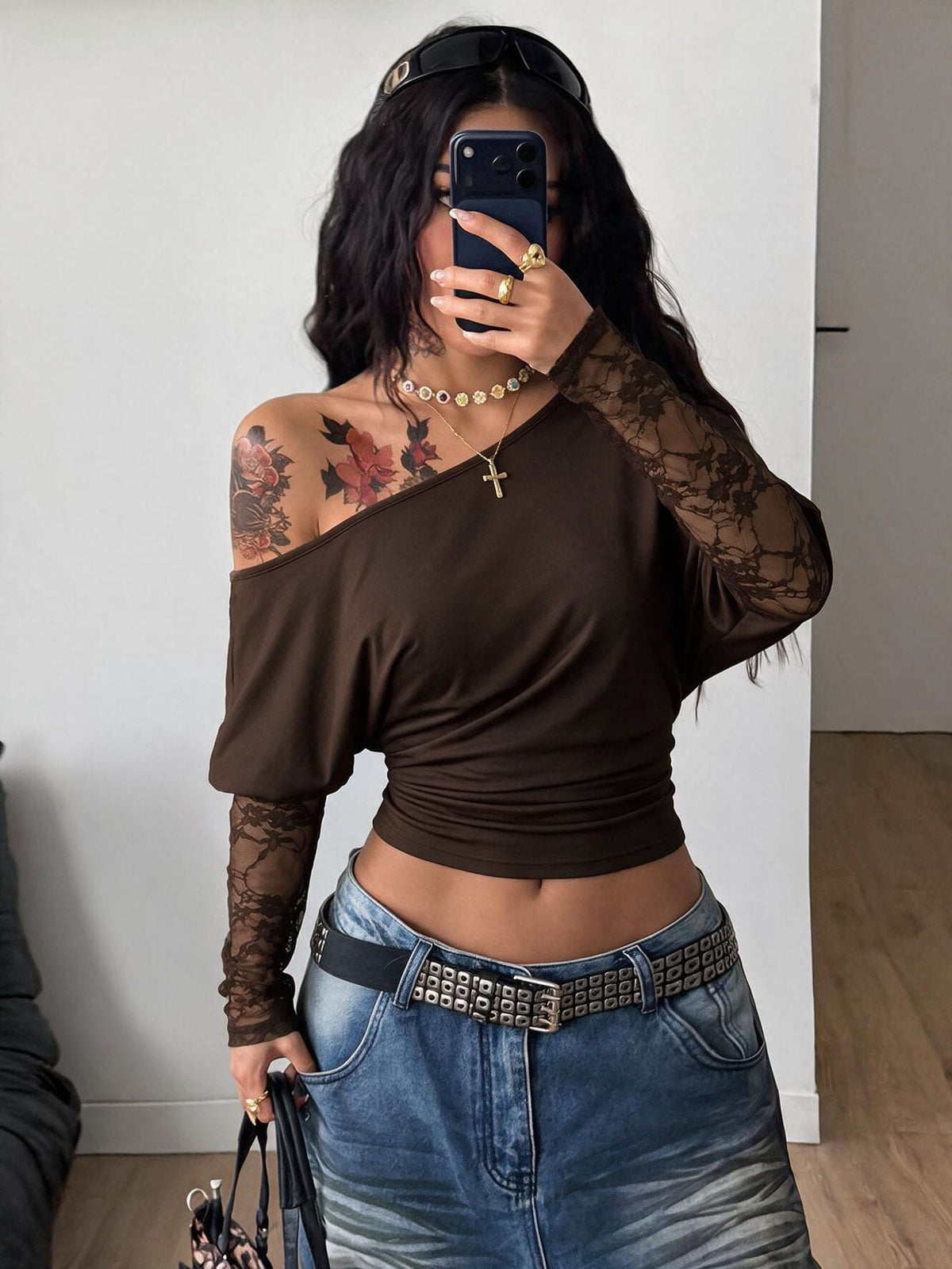 Women's black long sleeve t-shirt featuring delicate contrast lace details and a boat neckline in a knitted stretch fabric.