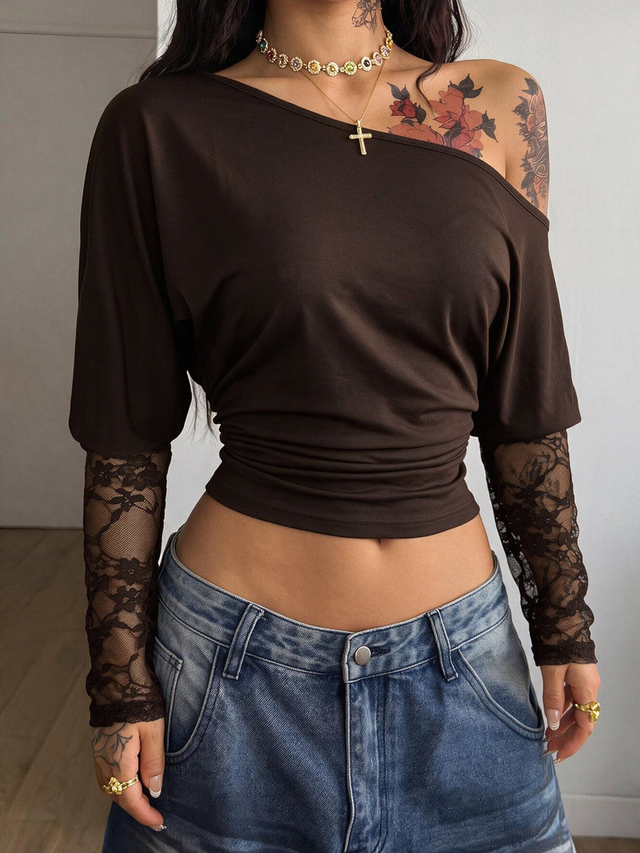 Women's black long sleeve t-shirt featuring delicate contrast lace details and a boat neckline in a knitted stretch fabric.
