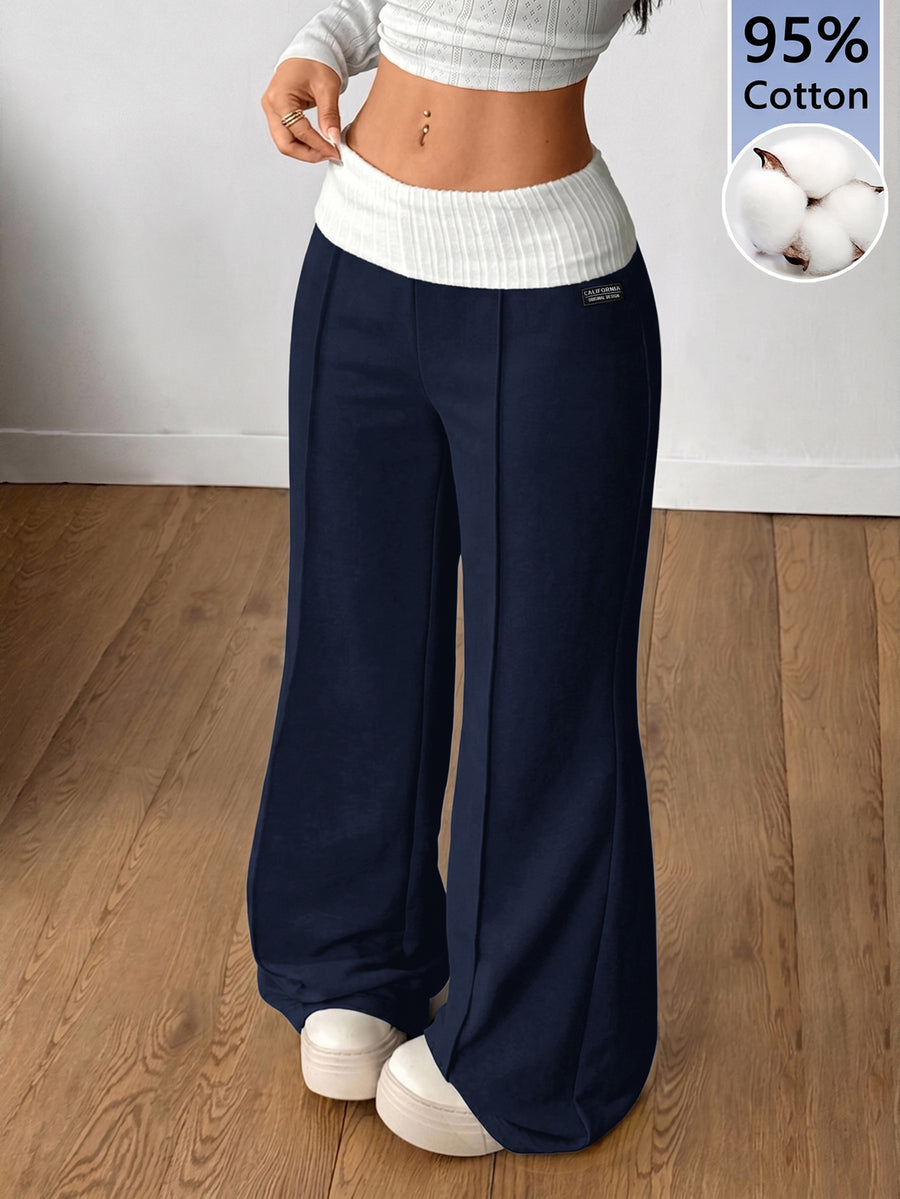 Women's wide leg flare lounge pants made of 95% cotton with a low elastic waistband and extra long hem.