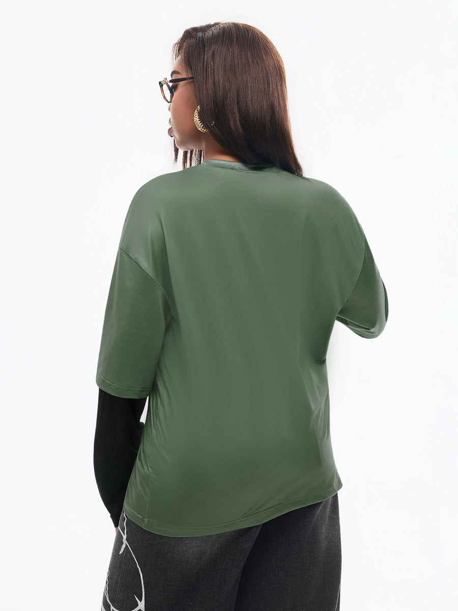 Women's casual graphic long sleeve t-shirt with a round neck, drop shoulder sleeves, and loose relaxed fit.