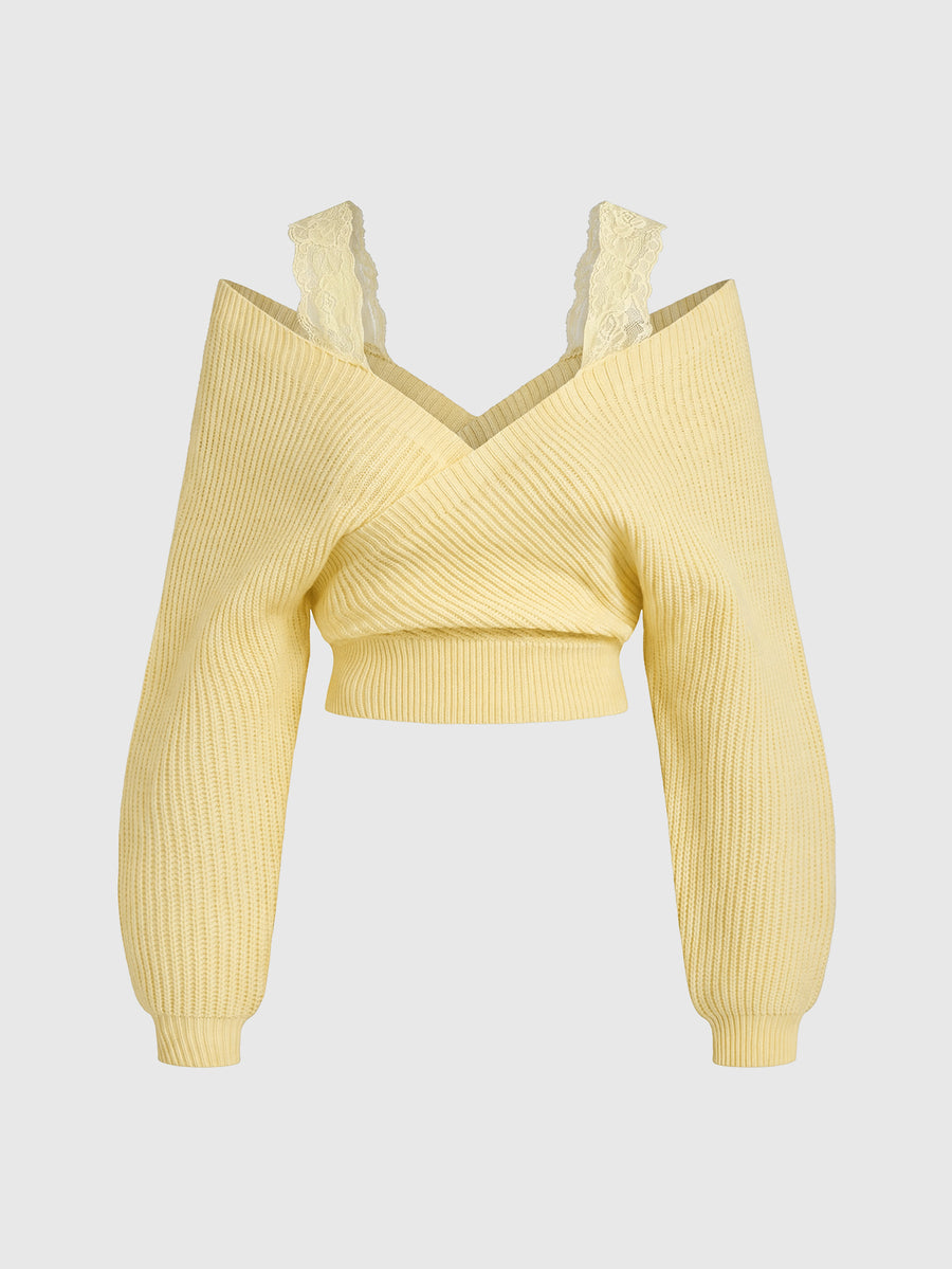 Women's two-piece rib-knit sweater set featuring a long-sleeve cold-shoulder crop top with strap details and matching wide-leg pants.