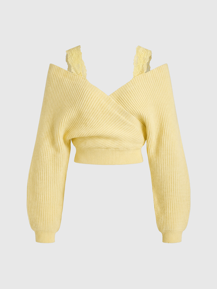 Women's two-piece rib-knit sweater set featuring a long-sleeve cold-shoulder crop top with strap details and matching wide-leg pants.