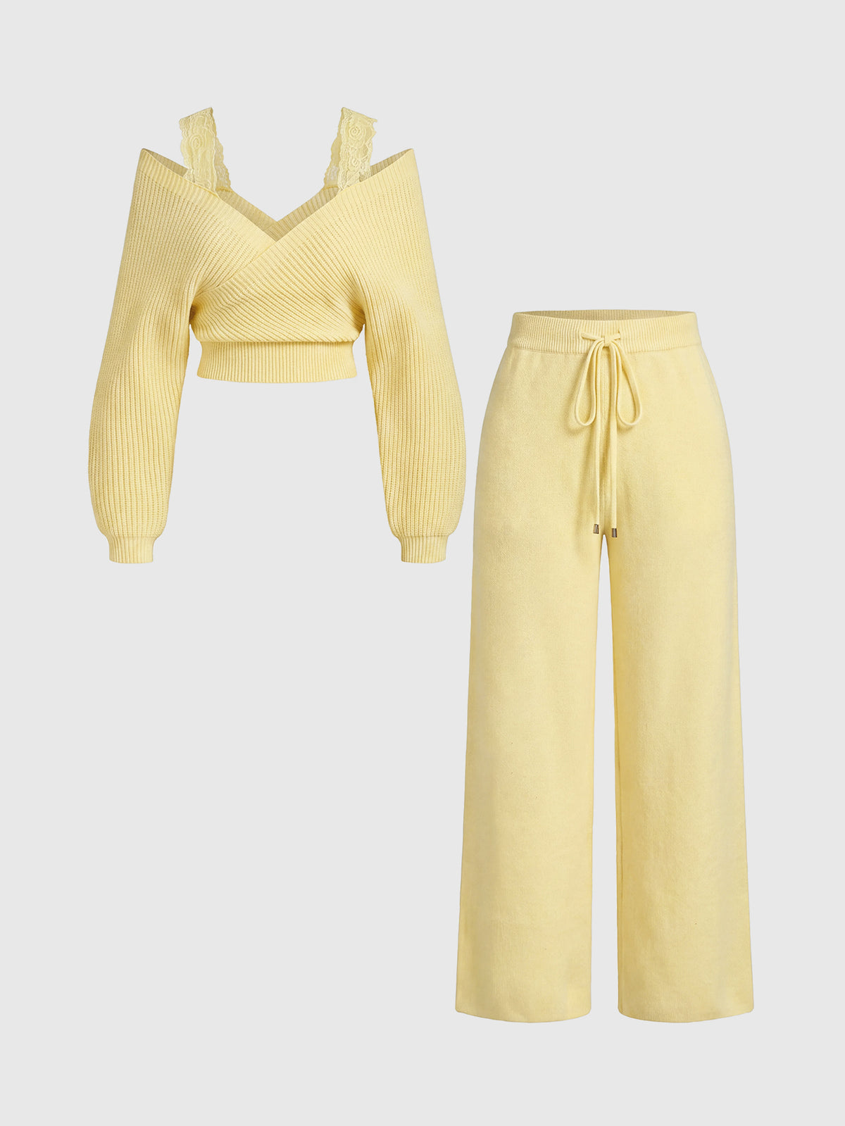 Women's two-piece rib-knit sweater set featuring a long-sleeve cold-shoulder crop top with strap details and matching wide-leg pants.