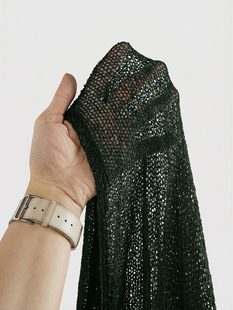 Women's casual hollow knit poncho top with boat neck, cloak sleeves, and asymmetrical hem