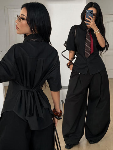Women's casual button up shirt with half sleeves, classic shirt collar, and chest pocket in a woven fabric.
