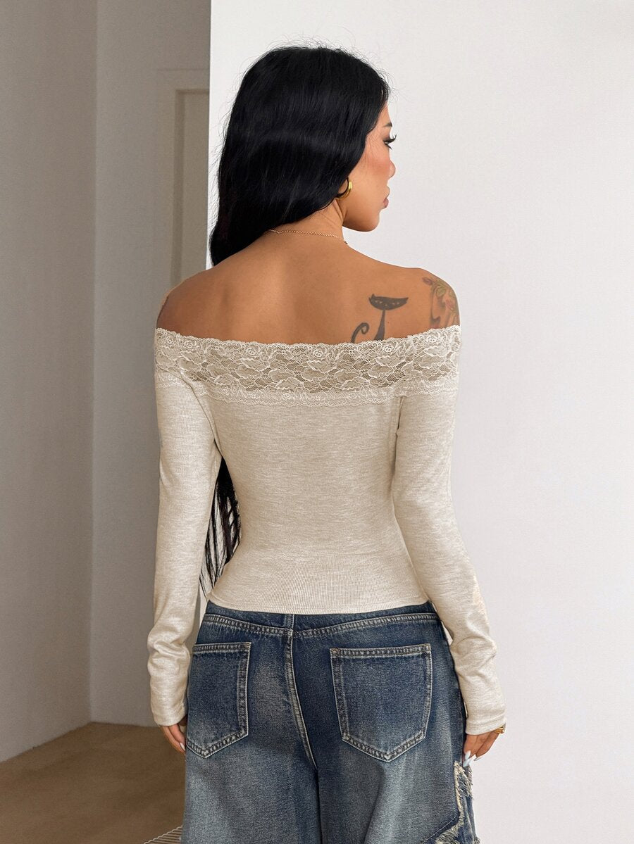 Women's slim fit off the shoulder long sleeve knitted top featuring contrast lace trim and ruched accents.