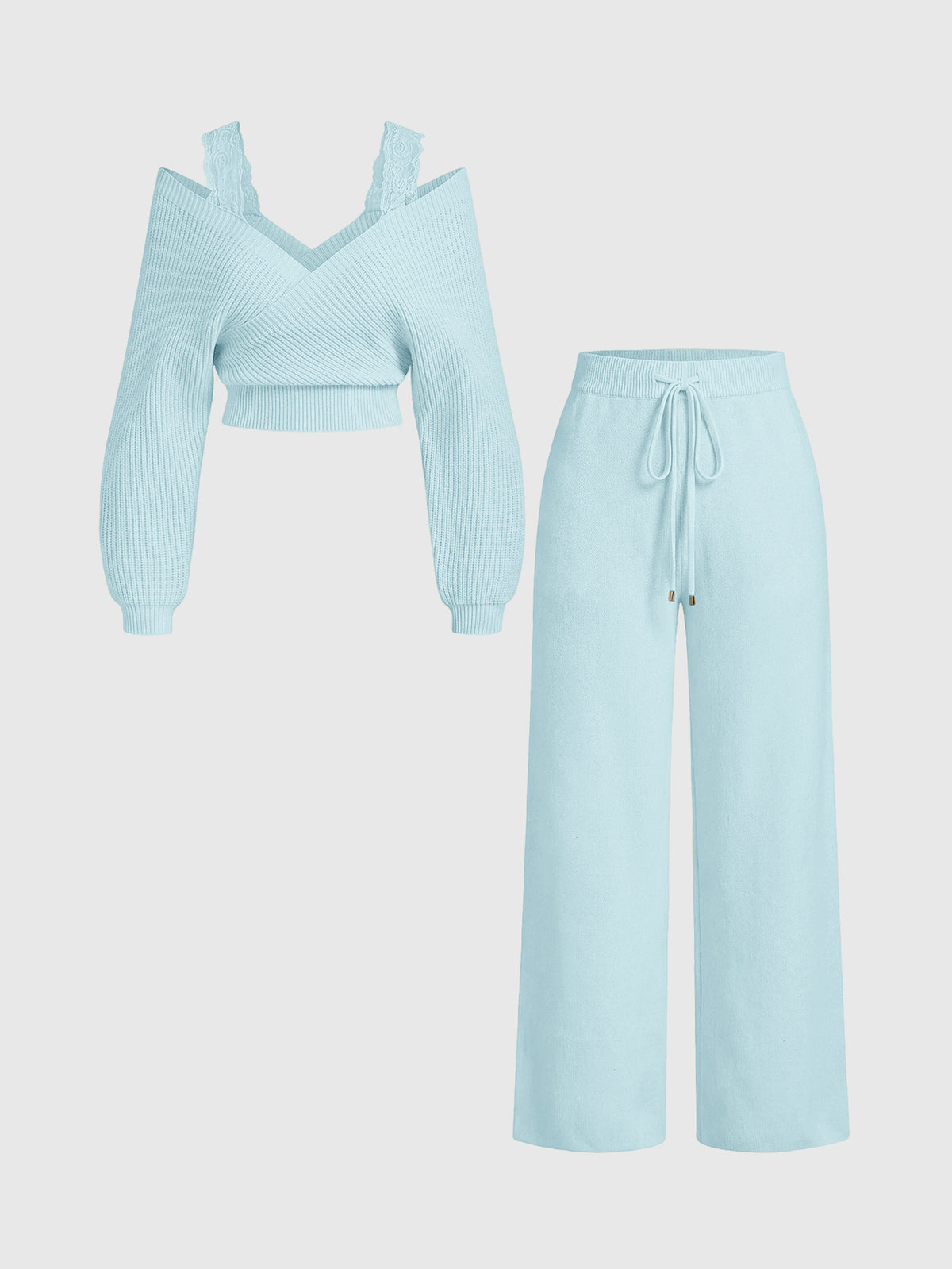 Women's two-piece rib-knit sweater set featuring a long-sleeve cold-shoulder crop top with strap details and matching wide-leg pants.
