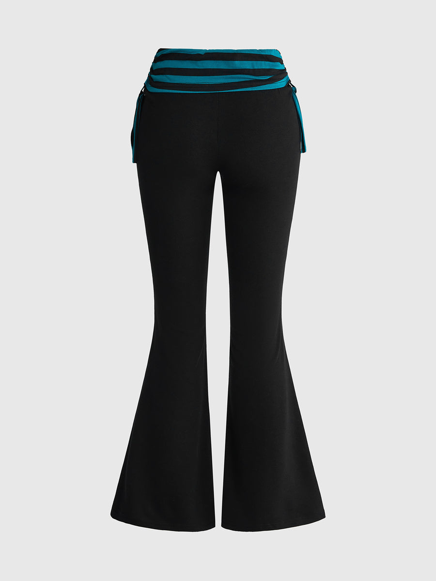 Women's low waist flare leg pants featuring an elastic drawstring waistband and ruched detail in knitted fabric.