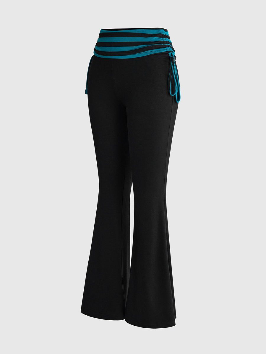 Women's low waist flare leg pants featuring an elastic drawstring waistband and ruched detail in knitted fabric.