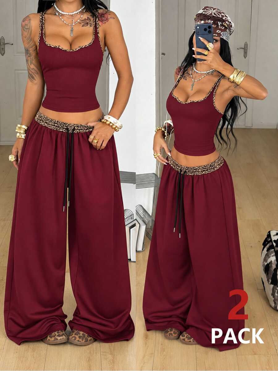 Women's two-piece casual outfit featuring a slim-fit camisole tank top with ruffle trim and button front paired with high-waisted wide leg pants.