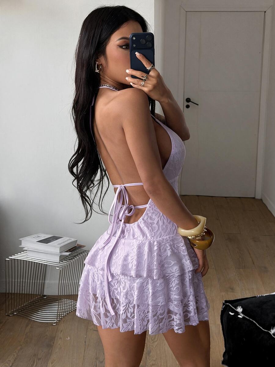 Front view of a women's lace halter mini dress featuring a slim-fit bodice, flared hem, and sleeveless design.