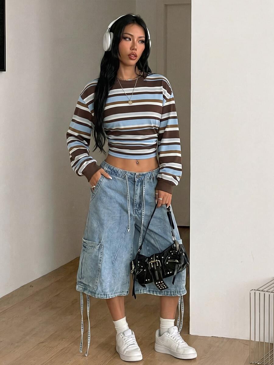 White striped long sleeve pullover sweatshirt for women featuring a round neck and drop shoulders.