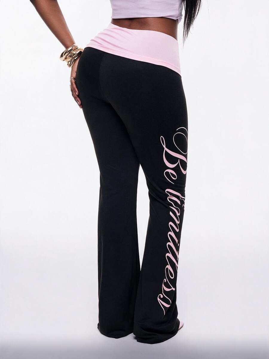 Women's black and white polka dot flare leg pants with side drawstring and ruched details