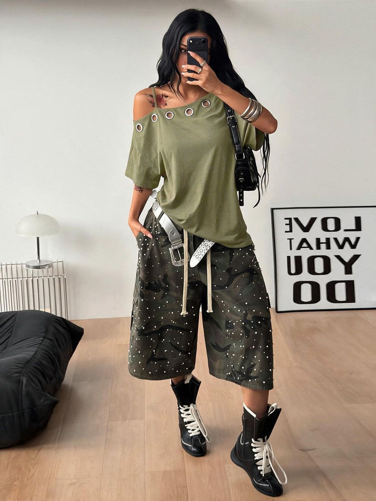 Women's casual loose fit cold shoulder cotton t-shirt with asymmetrical cutout neckline and short sleeves.