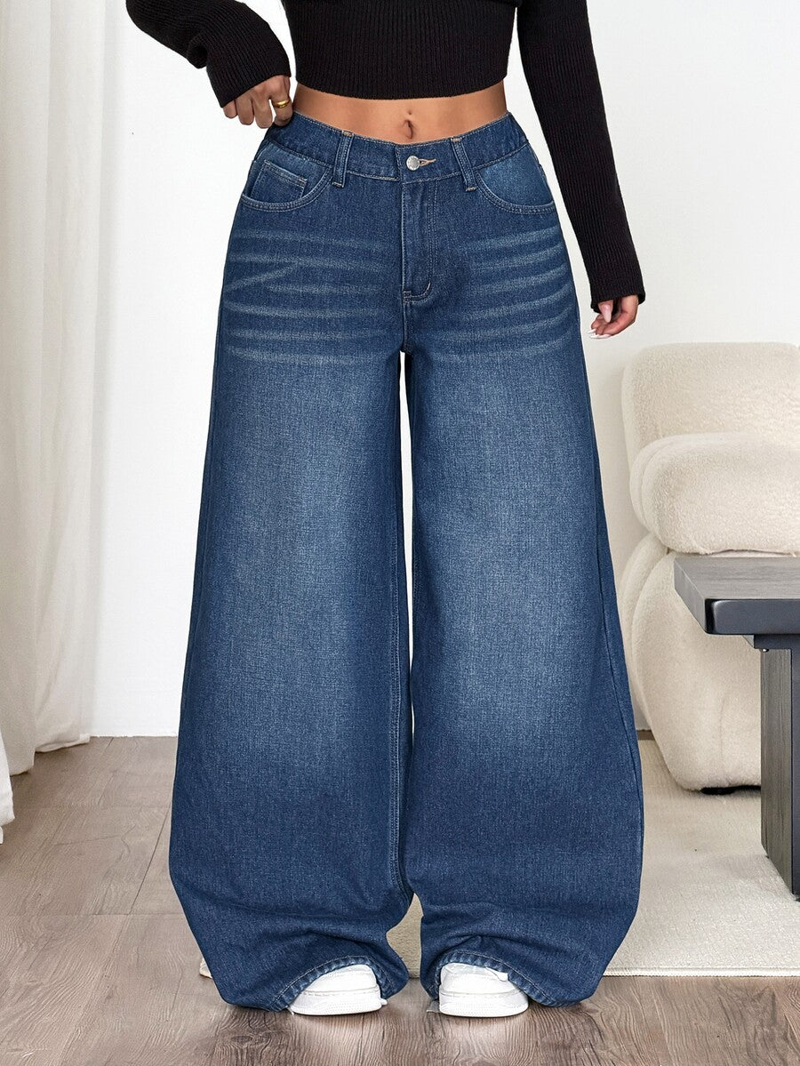 Women's loose wide-leg jeans in light wash denim with low waist and extra-long relaxed fit