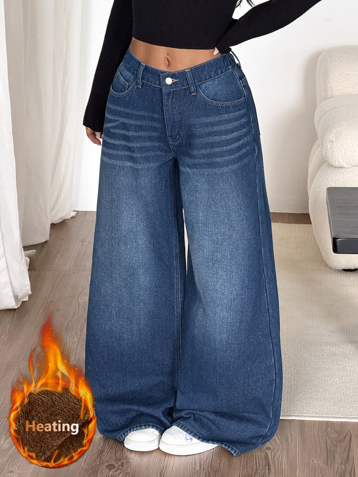 Women's loose wide-leg jeans in light wash denim with low waist and extra-long relaxed fit