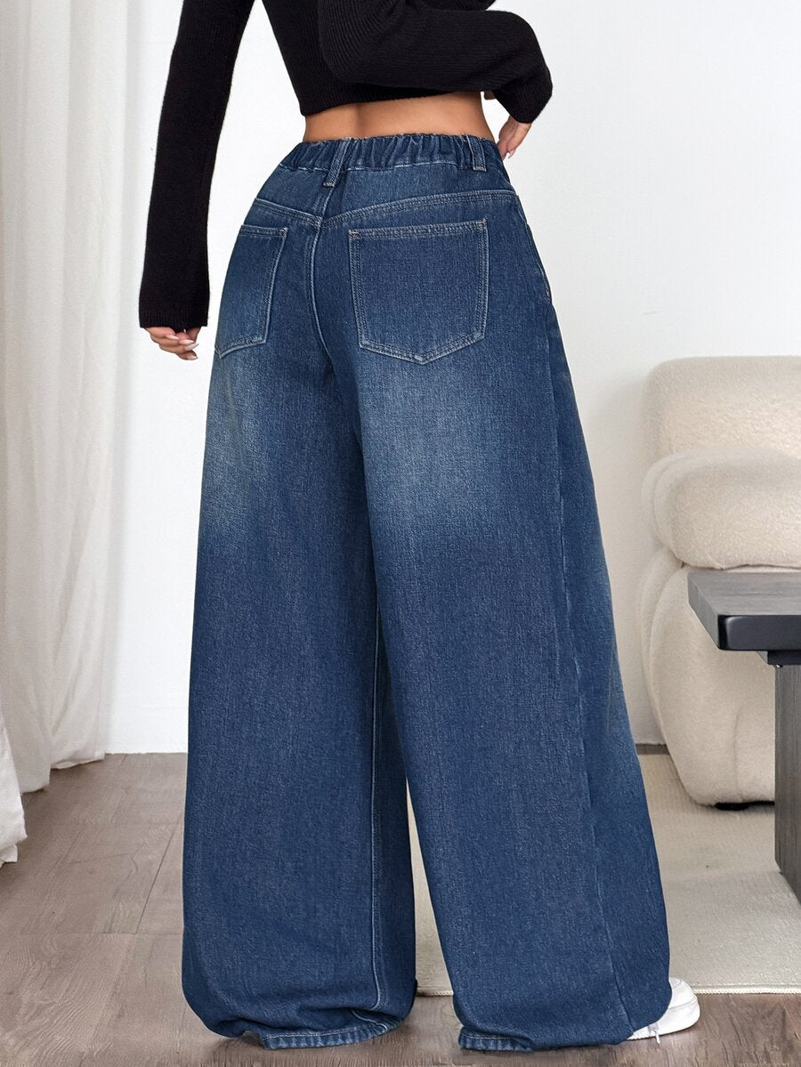 Women's loose wide-leg jeans in light wash denim with low waist and extra-long relaxed fit