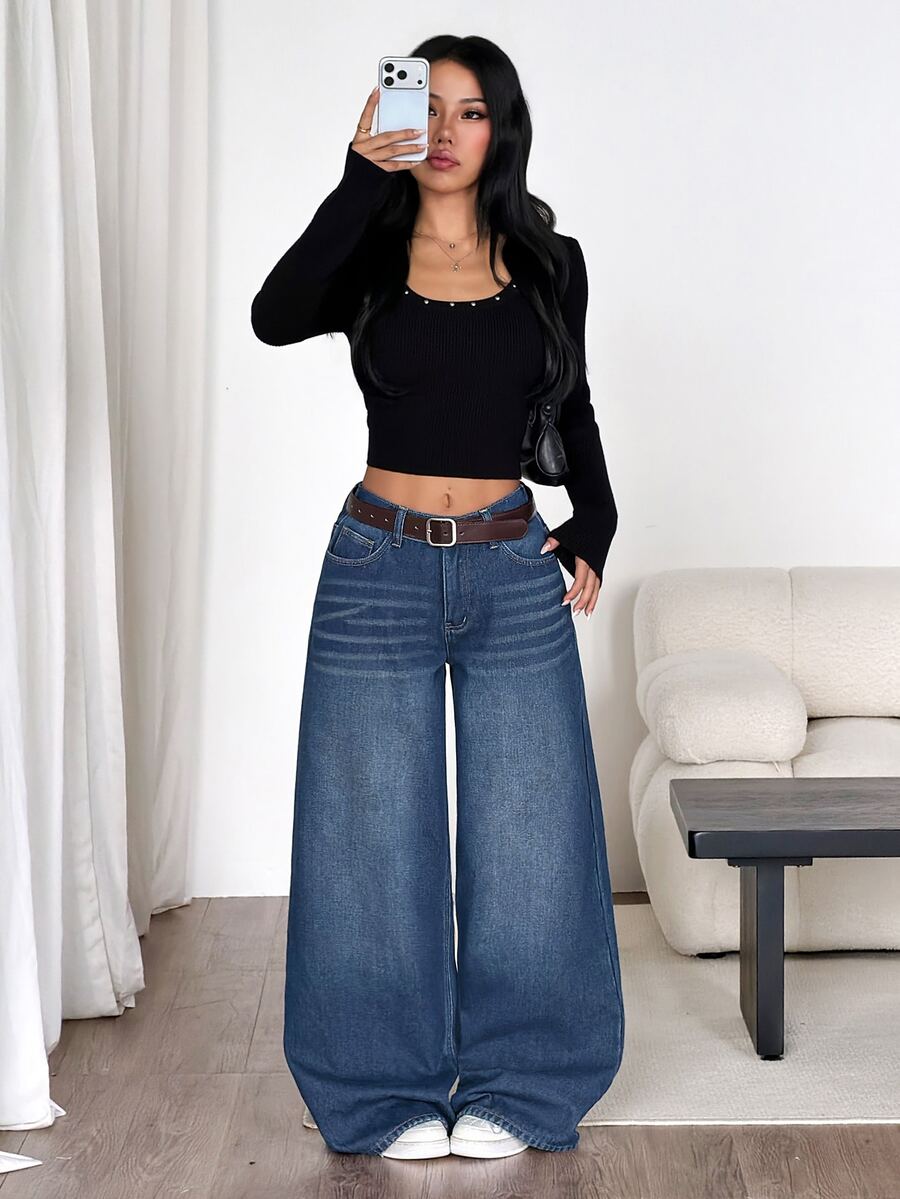 Women's loose wide-leg jeans in light wash denim with low waist and extra-long relaxed fit