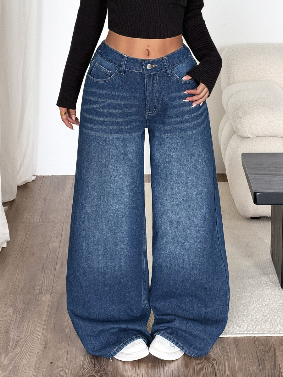 Women's loose wide-leg jeans in light wash denim with low waist and extra-long relaxed fit