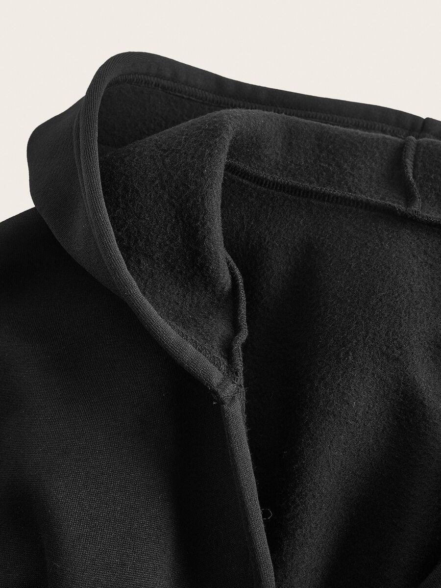 Women's black oversized zip-up hooded sweatshirt with drawstring hood and long sleeves.