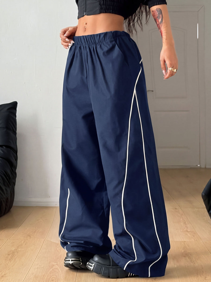 Plus size loose straight leg casual pants with elastic drawstring waist, contrast binding, and side pockets.