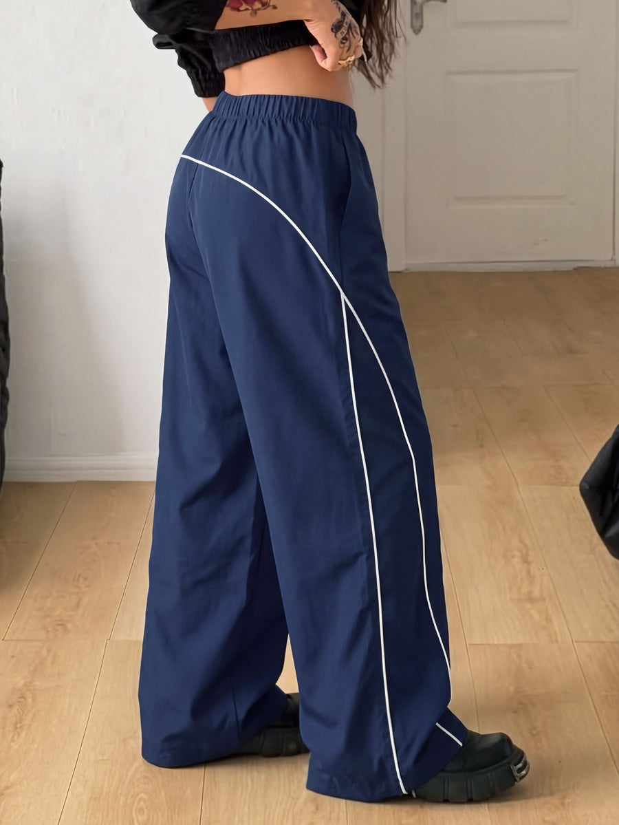 Plus size loose straight leg casual pants with elastic drawstring waist, contrast binding, and side pockets.