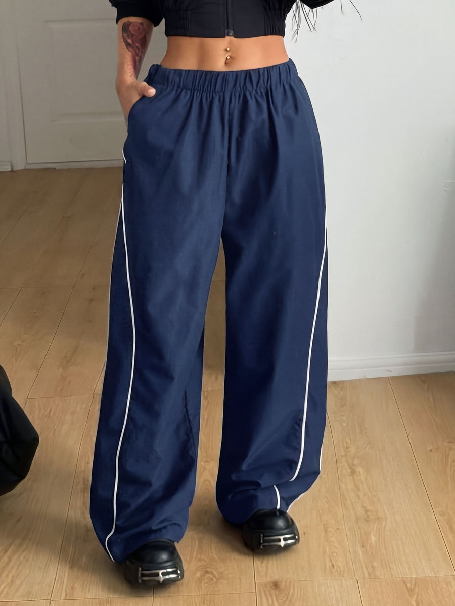 Plus size loose straight leg casual pants with elastic drawstring waist, contrast binding, and side pockets.