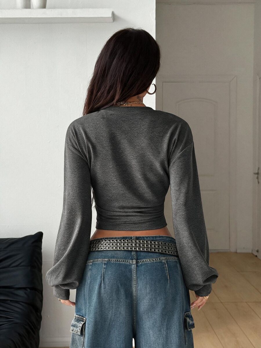 Women's brown waist-cinching sweatshirt featuring a round neck, drop shoulder long sleeves, and rib-knit cuffs.