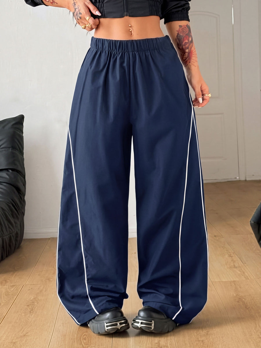 Plus size loose straight leg casual pants with elastic drawstring waist, contrast binding, and side pockets.