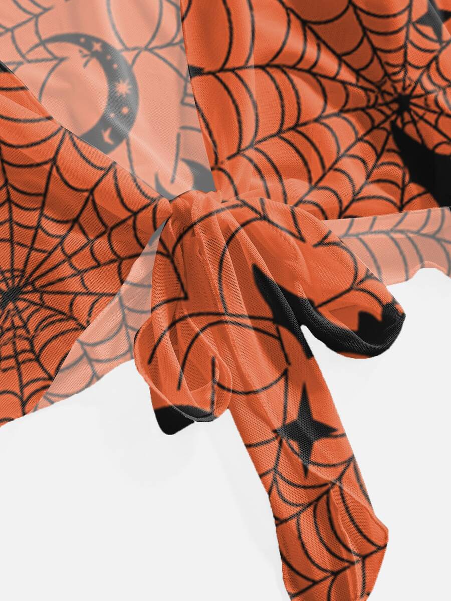 Orange knitted Halloween crop top for women featuring a moth, bat, and spider web print with a V-neck and front tie closure.