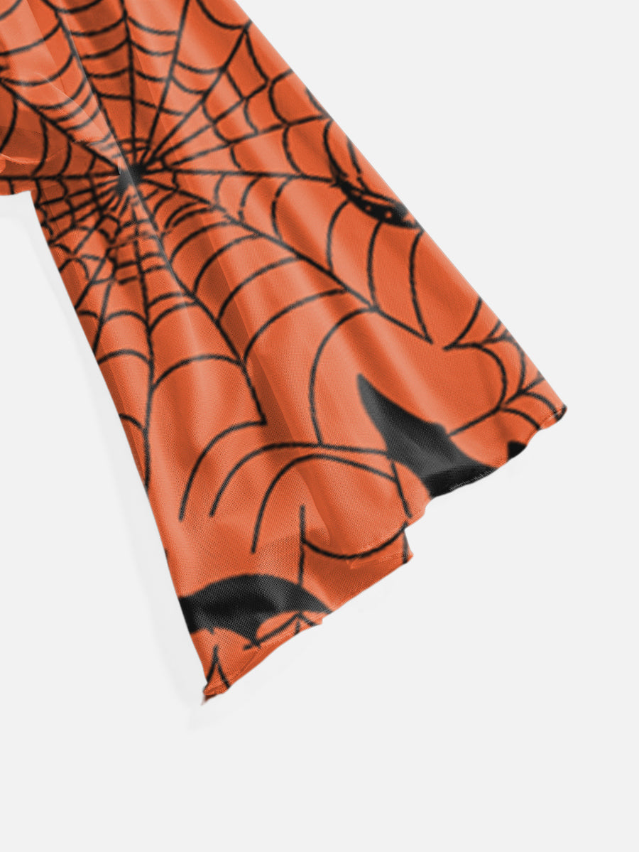 Orange knitted Halloween crop top for women featuring a moth, bat, and spider web print with a V-neck and front tie closure.