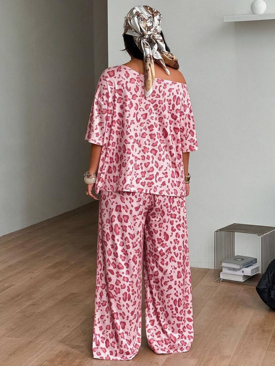 Women's two-piece lounge set featuring a loose drop shoulder asymmetrical neck short sleeve t-shirt and wide-leg knit pants with pockets.