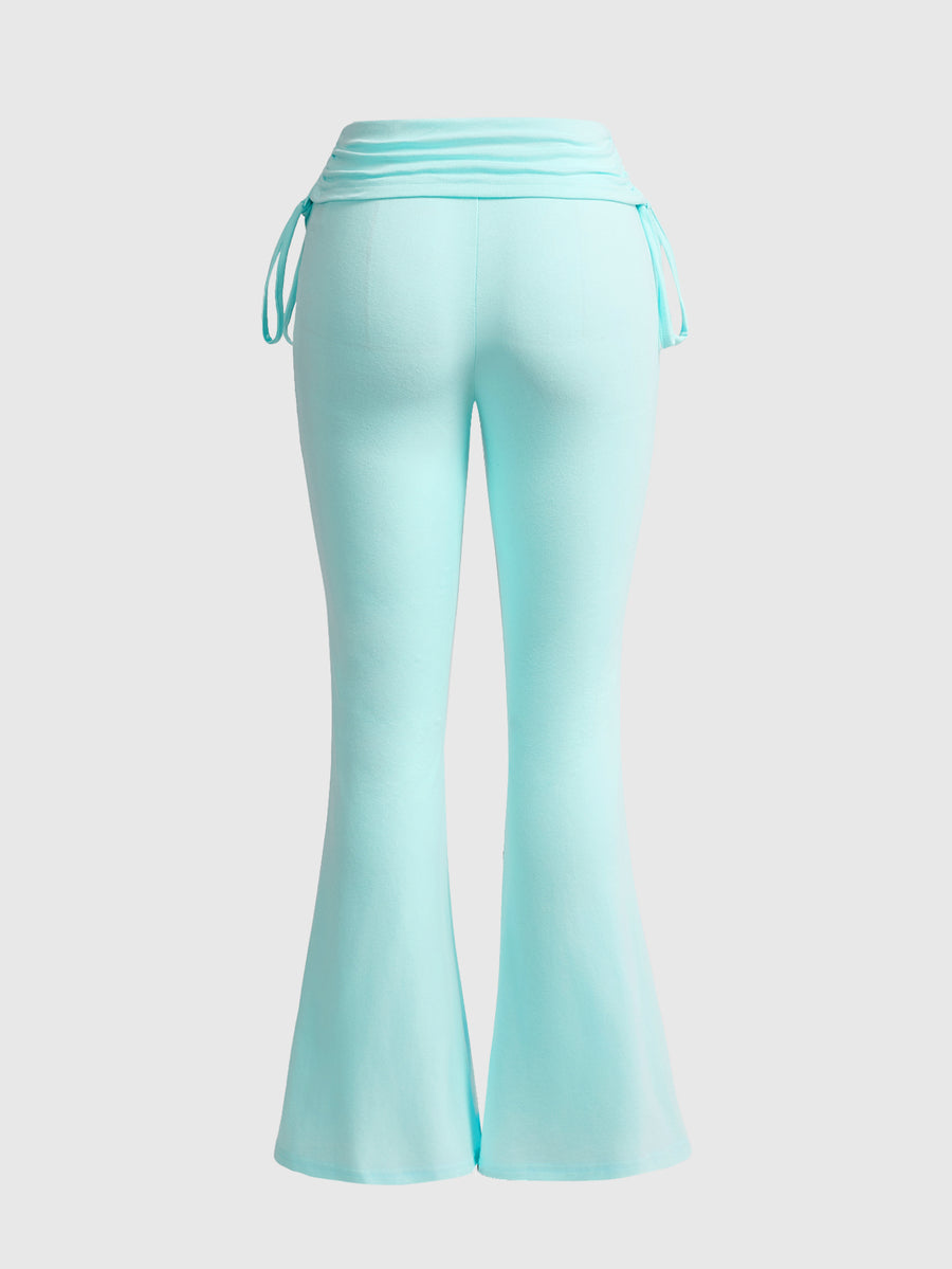 Women's low waist flare leg pants featuring an elastic drawstring waistband and ruched detail in knitted fabric.