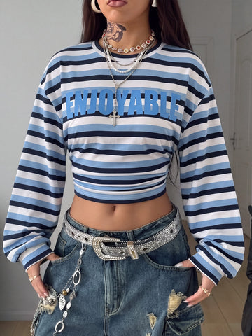 White striped long sleeve pullover sweatshirt for women featuring a round neck and drop shoulders.