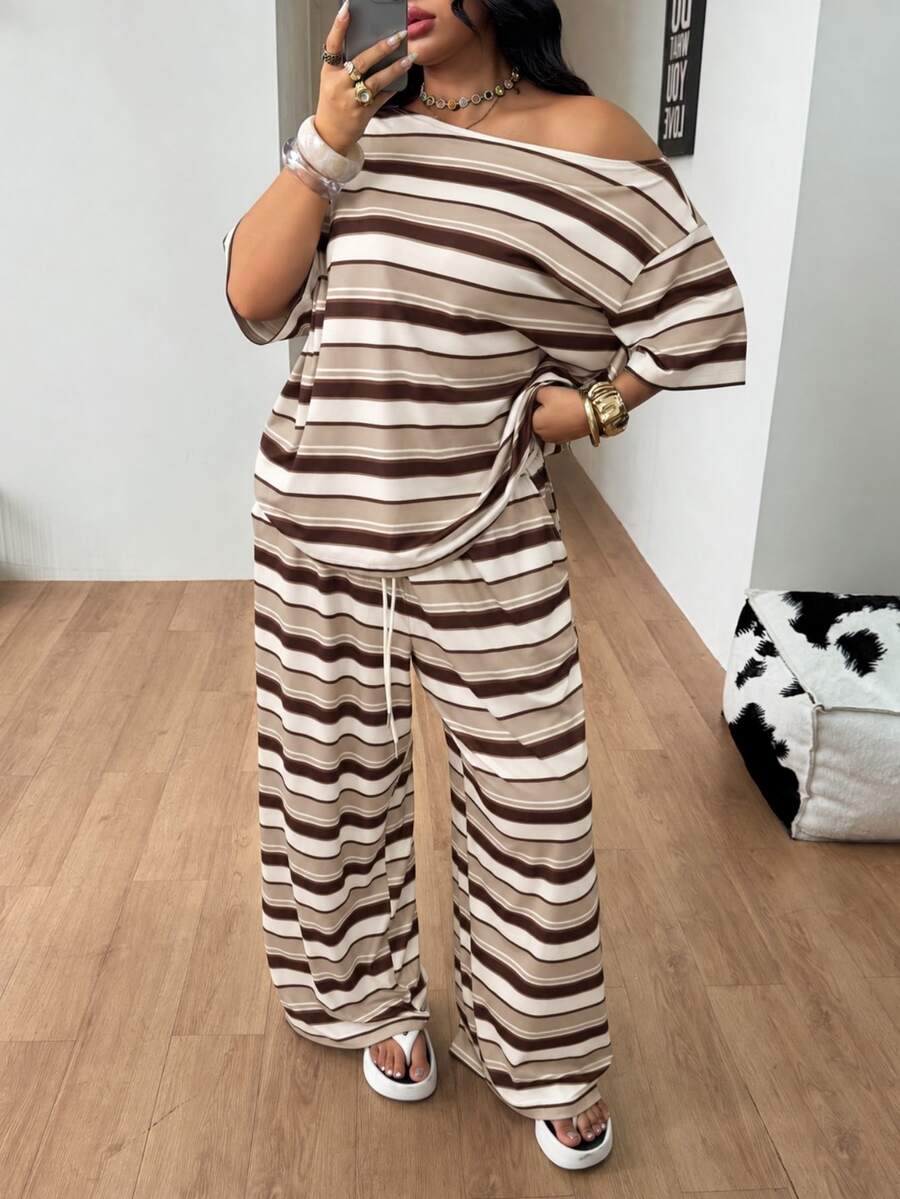 Striped two-piece casual outfit featuring an asymmetrical off-shoulder short-sleeve top and matching loose wide-leg pants with side pockets.