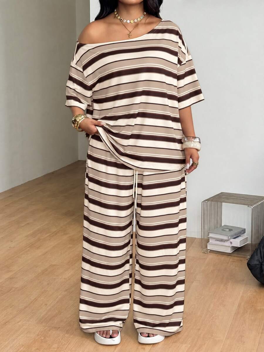 Striped two-piece casual outfit featuring an asymmetrical off-shoulder short-sleeve top and matching loose wide-leg pants with side pockets.