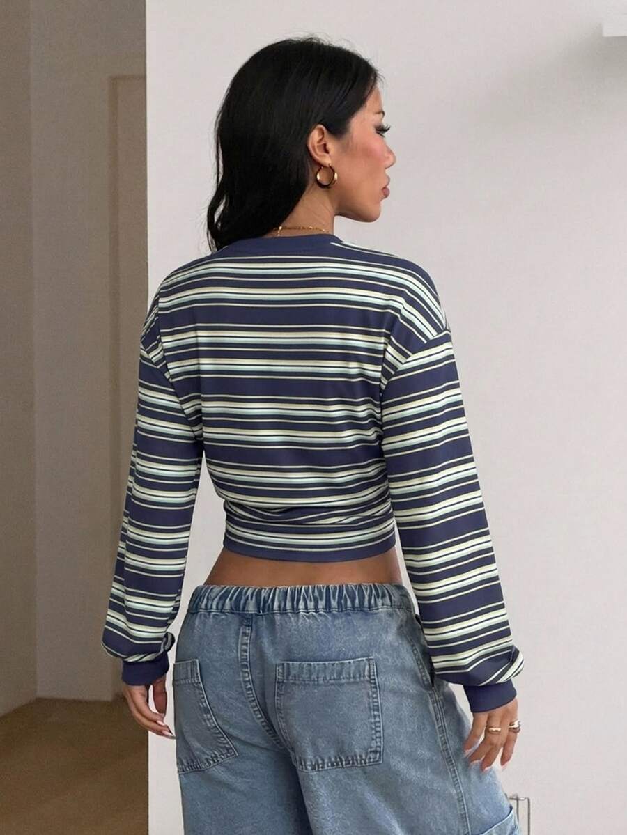 Women's brown waist-cinching sweatshirt featuring a round neck, drop shoulder long sleeves, and rib-knit cuffs.