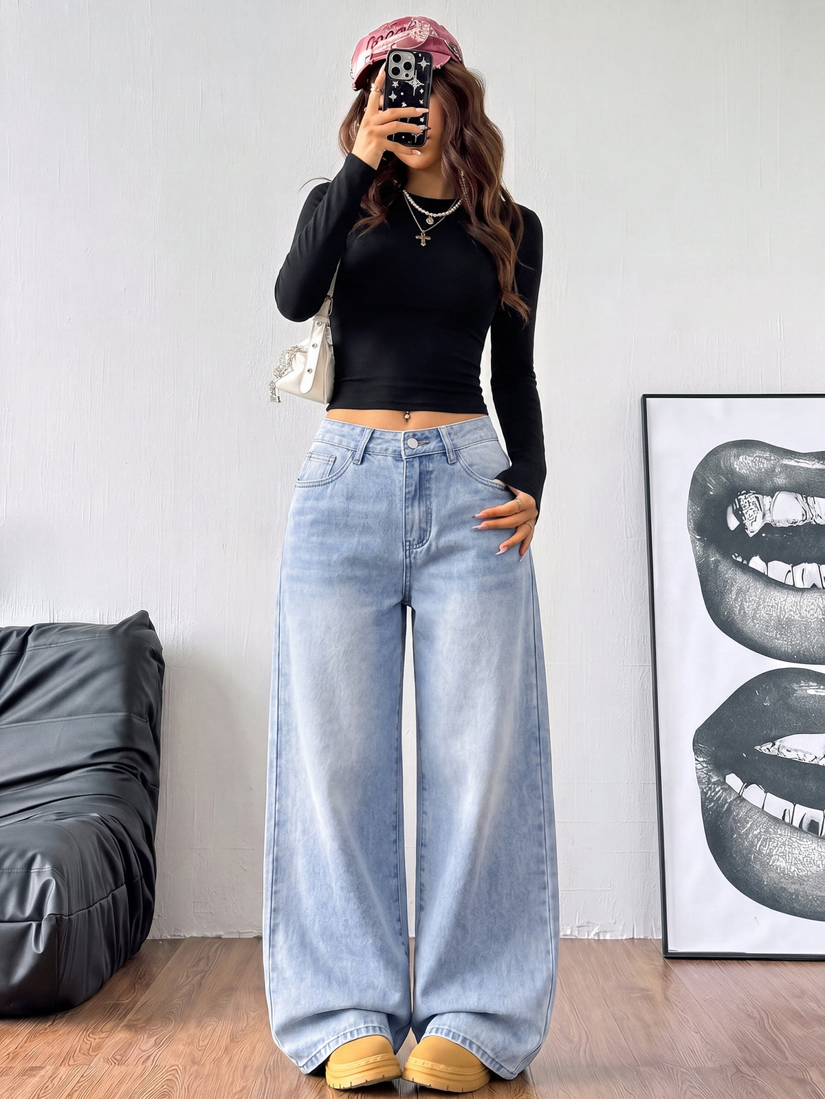 Women's loose wide-leg jeans in light wash denim with low waist and extra-long relaxed fit