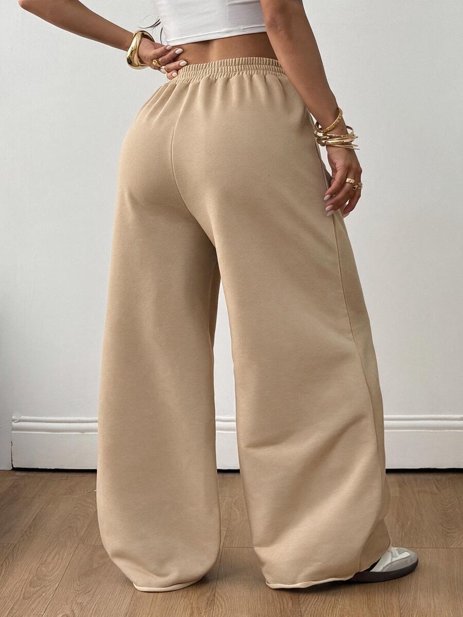 Women's loose wide leg casual sweatpants with an elastic waistband and side pockets