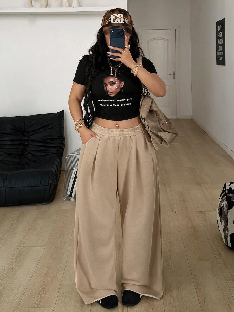 Women's loose wide leg casual sweatpants with an elastic waistband and side pockets