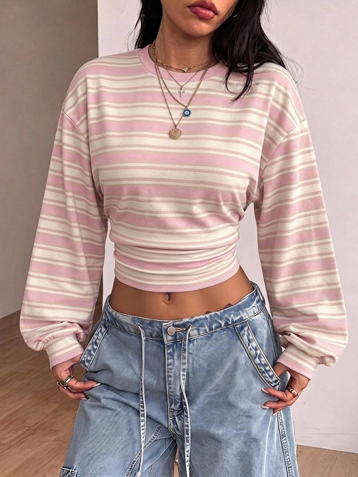 Women's brown waist-cinching sweatshirt featuring a round neck, drop shoulder long sleeves, and rib-knit cuffs.