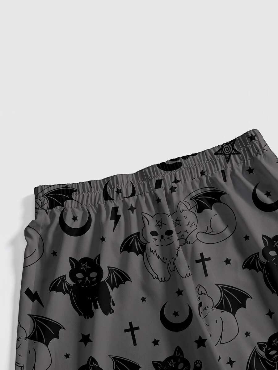 Women's plus size black gothic wide leg pants with split thigh detail and celestial moth, sun, and star pattern.