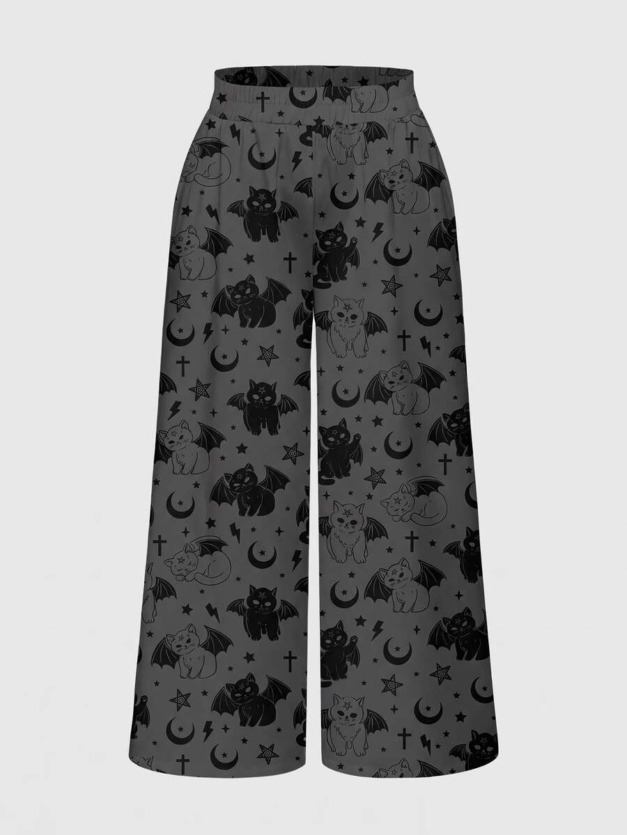 Women's plus size black gothic wide leg pants with split thigh detail and celestial moth, sun, and star pattern.