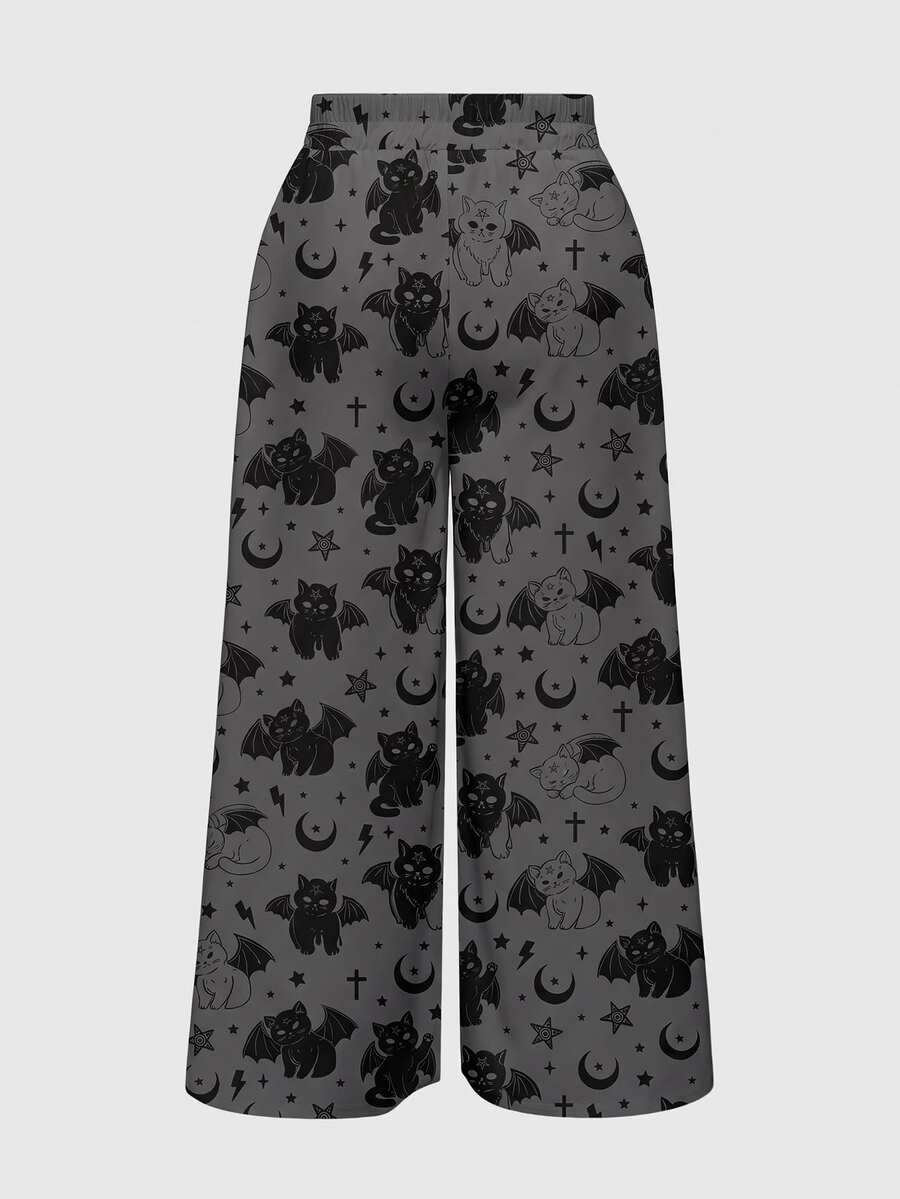 Women's plus size black gothic wide leg pants with split thigh detail and celestial moth, sun, and star pattern.