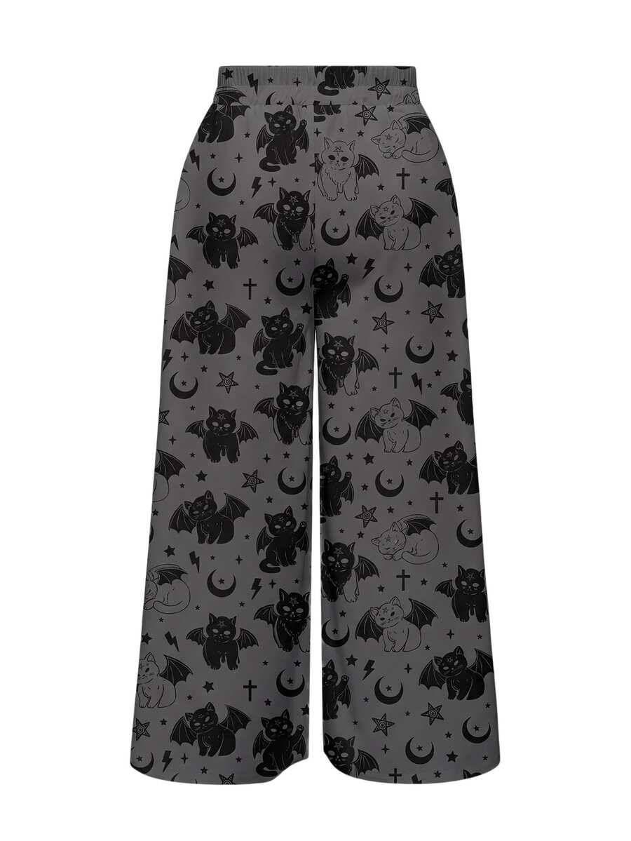 Women's plus size black gothic wide leg pants with split thigh detail and celestial moth, sun, and star pattern.