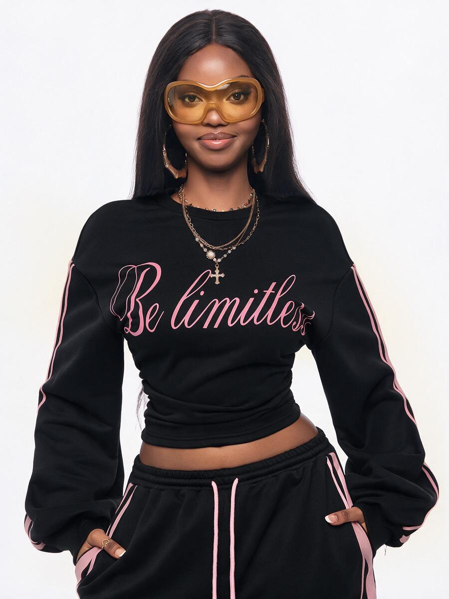 Women's casual black long sleeve knitted pullover sweatshirt featuring a round neck and cinched waist design.