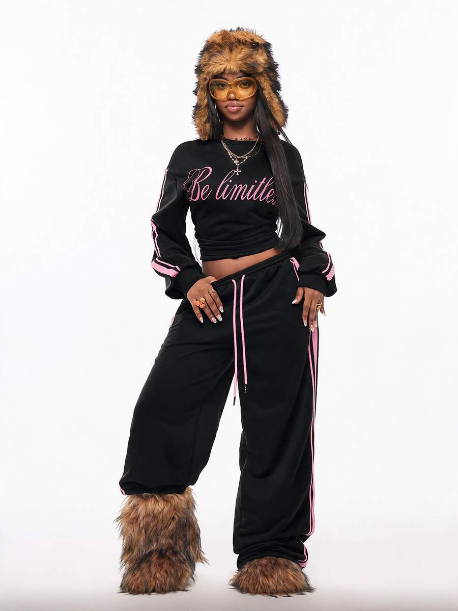 Women's casual black long sleeve knitted pullover sweatshirt featuring a round neck and cinched waist design.
